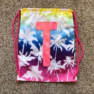 Justice draw string bag with a big sparkly t